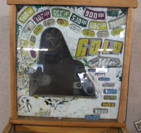 Image # 40337: Gold Mine Behind Backglass 
(The backglass is present but has so much paint peeling that very little artwork is left. Serial number 1729.)