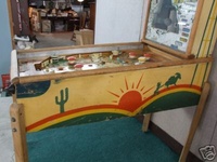 Image # 40343: Gold Mine Cabinet - Right 
(The backglass is present but has so much paint peeling that very little artwork is left. Serial number 1729.)