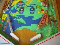 Image # 7365: Atlantis Lower Playfield 
(The metal pin is missing to the left of the copyright notice in the right inlane.)