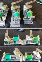 Image # 70783: Atlantis Flipper Mechanism Comparison 
(A sample Atlantis game used shorter flipper mechanisms (right side) than the production games. Shown here is a mechanism from a Surf Champ game (left side) which is the same mechanism used on Atlantis production games. The replacement coil and bushing shown here are immaterial to this comparison.)
