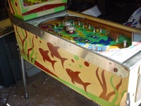 Image # 7366: Atlantis Cabinet - Left 
(The metal pin is missing to the left of the copyright notice in the right inlane.)