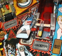 Image # 33095: Guns N' Roses Sample Game - Axl Plastic 
(The lower half of the plastic covering the scoop has the word 'Jackpot' barely evident. Production games instead have the words 'Mystery when lit' in this area. Game has serial number 110878 manufactured May 23, 1994.)