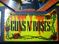 Image # 33423: Guns N' Roses Center Apron Sticker 
(Game has serial number 113655 dated Aug 9, 1994.)