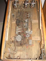 Image # 69504: Auto Race Inside Cabinet 
(The relay in the clear plastic case, to the right of the motor, is a replacement for the relay that was there and is not original to this game. Serial number E14989AR.)