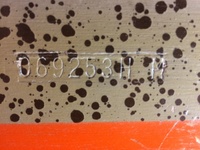 Image # 63926: Harvest Moon Cabinet - Serial Number 
(The owner described the cabinet base color as grey-purple. With the legs removed from this game, the original unfaded color can be seen on the cabinet corners. Serial number 069253HM.)