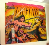 Image # 39791: Hercules Backglass 
(The backglass has two notches on the top, to mount in the box. It has three holes drilled and grommeted on the top and bottom edges. The score windows here have fake paper scores placed in them.)