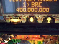 Image # 62209: Indiana Jones: The Pinball Adventure Early Production - Speaker Panel Jackpot Lights 
(These three lamps, shown here illuminated, were not installed in production games. The prototype serial number on this game was sanded/repainted by a previous owner and could not be read.)