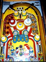 Image # 1281: Kewpie Doll Playfield 
(The two passive bumpers at the top are missing their rubber rings. Nearby, a large rubber ring was subtituted for the three correct smaller ones.)