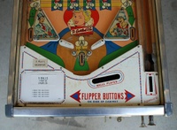 Image # 54259: Kings & Queens Lower Playfield 
(The white price card is not original to this game. It is made By Bally Mfg. Corp.)
