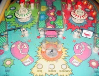 Image # 11608: Knockout Playfield - Detail 
(The left spinning target is missing from this playfield.)