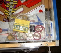 Image # 32282: Lady Luck Playfield Detail And Spare Parts 
(The game in this image was described to us as being newly removed from its original shipping carton. Note the blue film covering the metal side rail.)