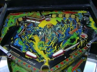 Image # 60791: Lightning Upper Playfield 
(The artist's name can see seen in the light blue area above the tip of the right flipper.)