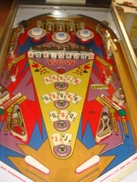 Image # 52728: Lucky Card Playfield - Modified Inlanes 
(On this game, the open elbow inlanes have been replaced with the standard closed-lane wireforms and the outlane mini-posts have been removed.)