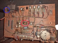 Image # 67435: Majorettes Sample Game - Motor Board - Annotated 
(Two relays on this board do not appear on the sample schematic. The relay circled in orange is labeled '1st coin relay'. The relay circled in blue is the 'Y' Relay (2nd coin relay). Serial number 01006 S.)