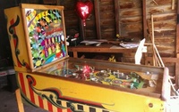 Image # 61252: Band Leader Cabinet - Left 
(The five posts below the pop bumpers incorrectly share a single rubber ring. Two of the white posts have been moved from their original factory positions. The six metal post spacers are missing from this playfield.)