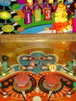Image # 24143: Band Leader Upper Playfield 
(This game should use white rubber rings. The five posts below the pop bumpers incorrectly share a single rubber ring.)