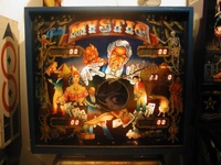 Image # 10505: Mystic Early Production Backglass 
(In this early backglass version, the center eye is recessed into the backbox and, when lit, creates a 3-D effect. This image is from the game with serial number EMY1060, the 60th game produced.)