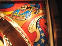 Image # 37010: Nitro Ground Shaker Plastic Playfield - Detail 
(This game has a plastic composite playfield.)