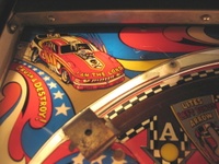 Image # 37009: Nitro Ground Shaker Plastic Playfield - Detail 
(This game has a plastic composite playfield.)