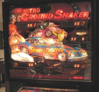 Image # 37007: Nitro Ground Shaker Illuminated Backglass 
(This game has a plastic composite playfield.)