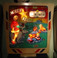 Image # 52590: North Star Sample Game - Illuminated Backglass 
(The gold stars between the score reels are stickers added by the game owner. Serial number 01046 S.)