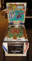 Image # 48730: North Star Sample Game - Front View 
(The two passive bumpers at the very top of the playfield have blue skirts. Their caps should also be blue. The backglass has red fade. Cabinet has partial serial number ending with '076 S'.)