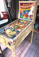Image # 79152: Oasis Cabinet - Right 
(The toggle switch above the backglass is not original to this game. The cabinet has been stripped of its paint.)