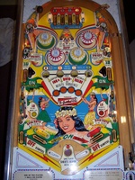 Image # 31457: Paradise Sample Game - Playfield 
(Not discernable in this image, the highest point of each flipper inlane has the words '10 points' painted over in yellow. A thin red arrow still points outward from this area. Serial number '01081 S'.)