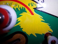 Image # 31479: Paradise Sample Game - Factory Paint-over 
(The words '10 points' apparently had a green background and were painted over in yellow. A thin red arrow still points outward from this area. Serial number '01081 S'.)