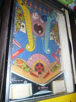 Image # 42736: Planets Playfield - After-Factory Pop Bumpers 
(The pop bumpers are not original to this game. The center spinning disk came from the factory with only one post on it. From the game with numbers 99609 and 99611.)
