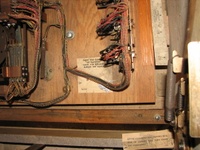 Image # 45764: Pleasure Isle No Replay Counter 
(The card stapled here to the wood normally fits over the replay counter on replay games to be visible through the open coin door during collection. Serial number 08195.)