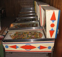 Image # 45765: Pleasure Isle Cabinet - Right 
(The thin blue strip of wood at the rear edge of the backbox is not original to this game. Serial number 08195.)