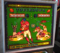 Image # 38997: Quarterback Pre-Production Backglass 
(It is believed this glass was made by Ad Posters for a pre-production presentation of this game. This glass was re-installed into a Quarterback backbox for this photo.)