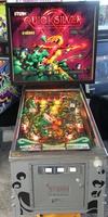Image # 63794: Quicksilver Illuminated Front View 
(The three coin insert plates were not original to this game.)
