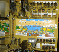Image # 83193: Race-Way Inside Two Tilt Backbox 
(The dual outlet box is an after-factory modification and the fuse block below it is a replacement. The scenic artwork and white relay strips are reproduction.)