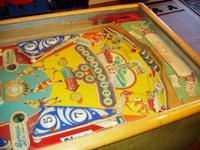 Image # 63956: Basketball Lower Playfield 
(The white flipper-shaped posts are stationary and were moved from their factory location on the outside ends of rebounds #9 and #10. The cabinet has been repainted.)