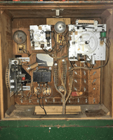 Image # 79676: Red Shoes Inside Backbox 
(A light bulb is missing from the socket and would shine through the rectangular hole in the insert to illuminate the backglass.)