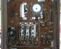 Image # 32543: Reserve Inside Backbox 
(A bell and coil assembly is missing from the upper left corner of the insert.)
