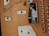 Image # 70400: Rocket Ship Game Over Lamp Hole 
(Where the lamp is missing in this picture, neither a lamp socket or wiring was installed by the factory.)