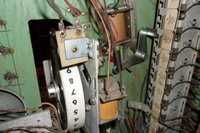 Image # 70401: Rocket Ship Game Over Lamp Hole 
(In this picture, a red straw has been inserted into the hole where neither a lamp socket or wiring was installed by the factory.)