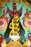 Image # 34840: Abra Ca Dabra Sample Game - Playfield - Detail 
(The small white lights shields at the bottom of this image may not be original to sample games. They do not appear on the flyer. Serial number 01015 S.)