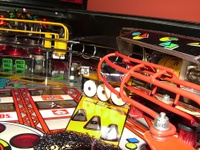 Image # 38885: Rollergames Atomic Whip Targets 
(The rose-colored plastic above the green drop targets is not original to this game.)