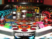 Image # 38886: Rollergames Ball View 
(The rose-colored plastic above the green drop targets and below the pop bumper cap is not original to this game.)