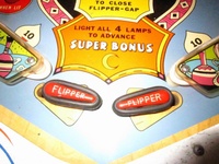 Image # 58008: Bazaar Flippers Closed 
(Bally manufactured this game using white flippers with white rubbers on them.)