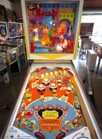 Image # 58011: Bazaar Cabinet - Front View 
(Bally manufactured this game using white flippers with white rubbers on them.)