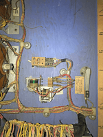 Image # 74612: Safari Replay Mode Shorting Plug Installed 
(In the wood near the jack, two starter holes can be seen where the optional Add-A-Ball Relay Assembly would be mounted. Serial number 1971.)