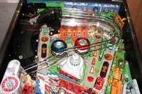Image # 31656: Secret Service Upper Playfield 
(The two spinning targets do not match the game in the manufacturer's flyer. The bumper cap colors are reversed as well.)