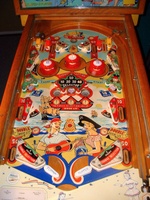 Image # 66231: Serenade Playfield 
(The owner states the pop bumpers caps, standup targets, and flippers are replacement parts.)