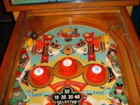Image # 66232: Serenade Upper Playfield 
(The owner states the pop bumpers caps, standup targets, and flippers are replacement parts.)