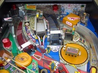 Image # 10161: The Addams Family Special Collectors Edition Upper Playfield 
(Note that this machine includes a custom thing hand decal on thing's box as well as a custom backdrop.)